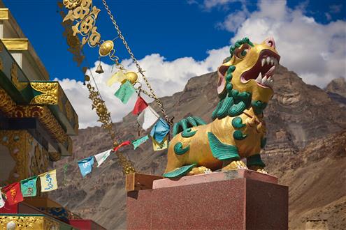 The Royal Walk in the Himalayas Stone sculpture of Shishi or Lion of Buddha (Buddhist guardian lion with magical properties and power to repel evil spirits) in front of ancient Buddhist monastery Tabo in Spiti (Custom).jpg